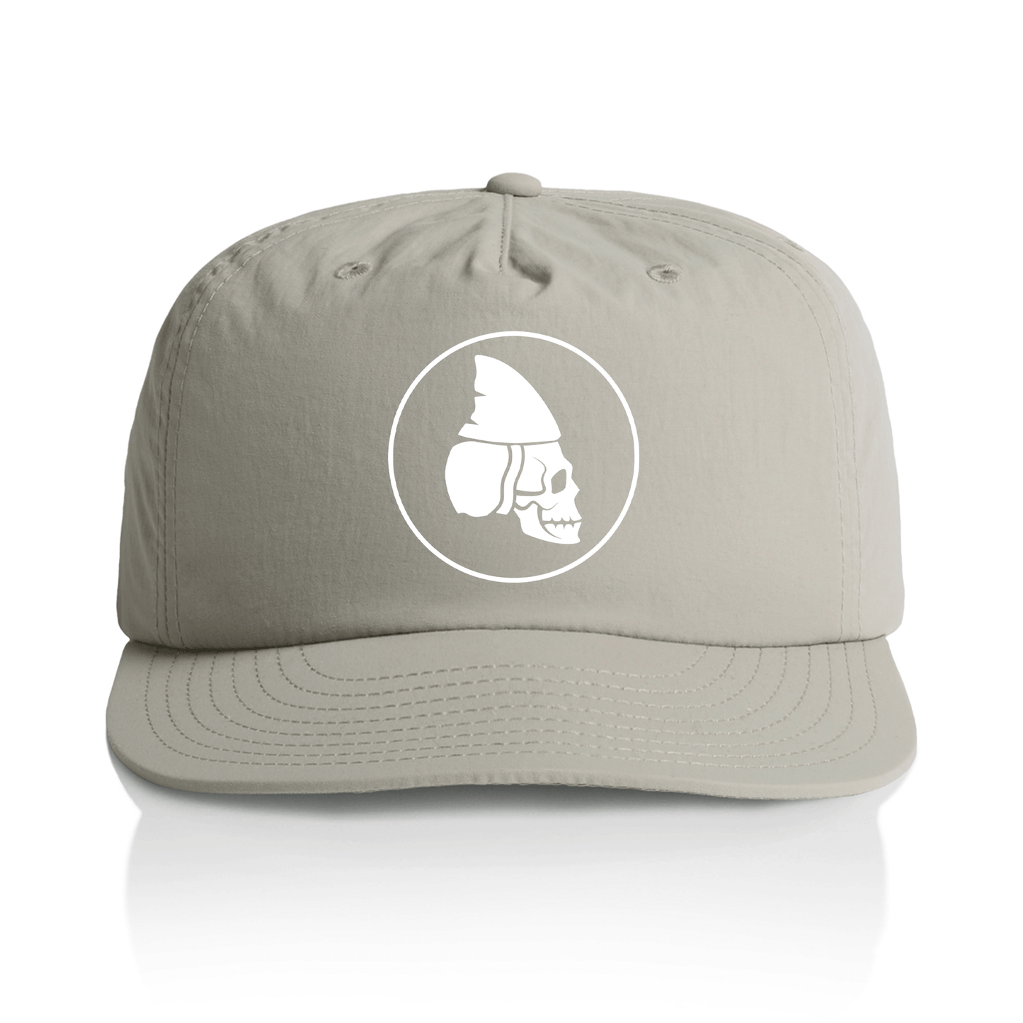 A grey quick dry baseball cap with a white circular graphic on the front featuring a stylized skull wearing a shark fin helmet, shown against a clean white background.