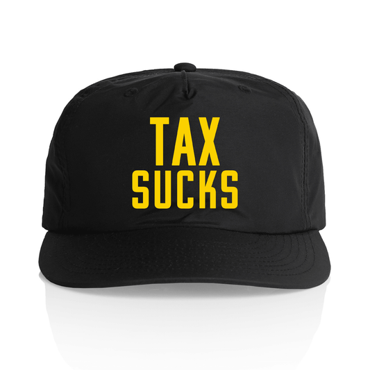 A black baseball cap with the words 'TAX SUCKS' printed in bold yellow capital letters on the front, shown against a clean white background with a subtle reflection.